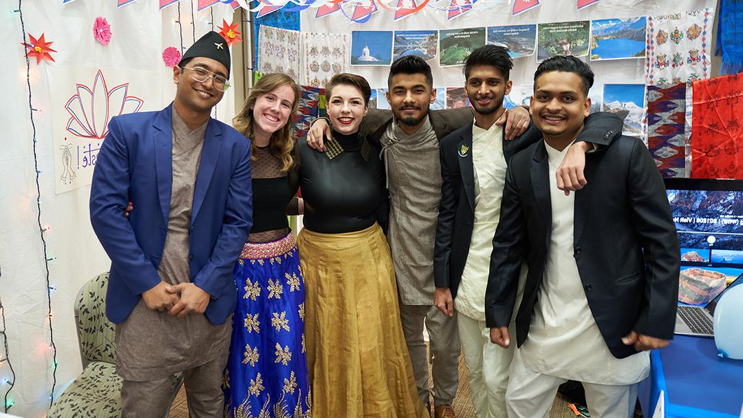 UE international students posing together at the International Bazaar